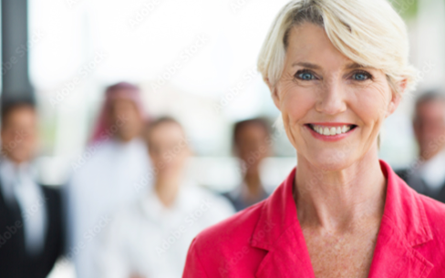 woman smilling. She is wearing a red dress